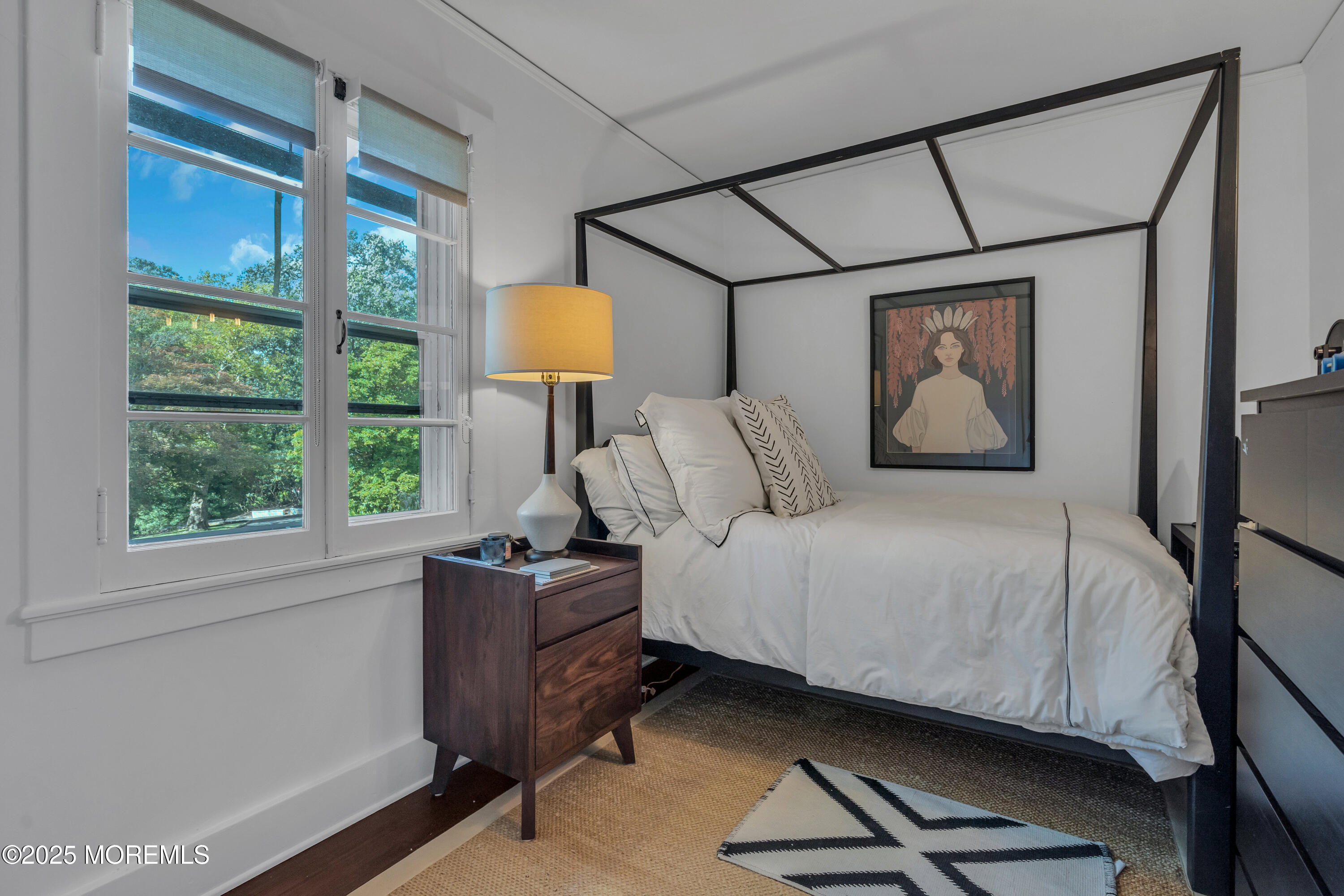 809 Navesink River Road Rumson, NJ 07760 - Photo 26 of 45 a bedroom with a bed a lamp on desk and a window