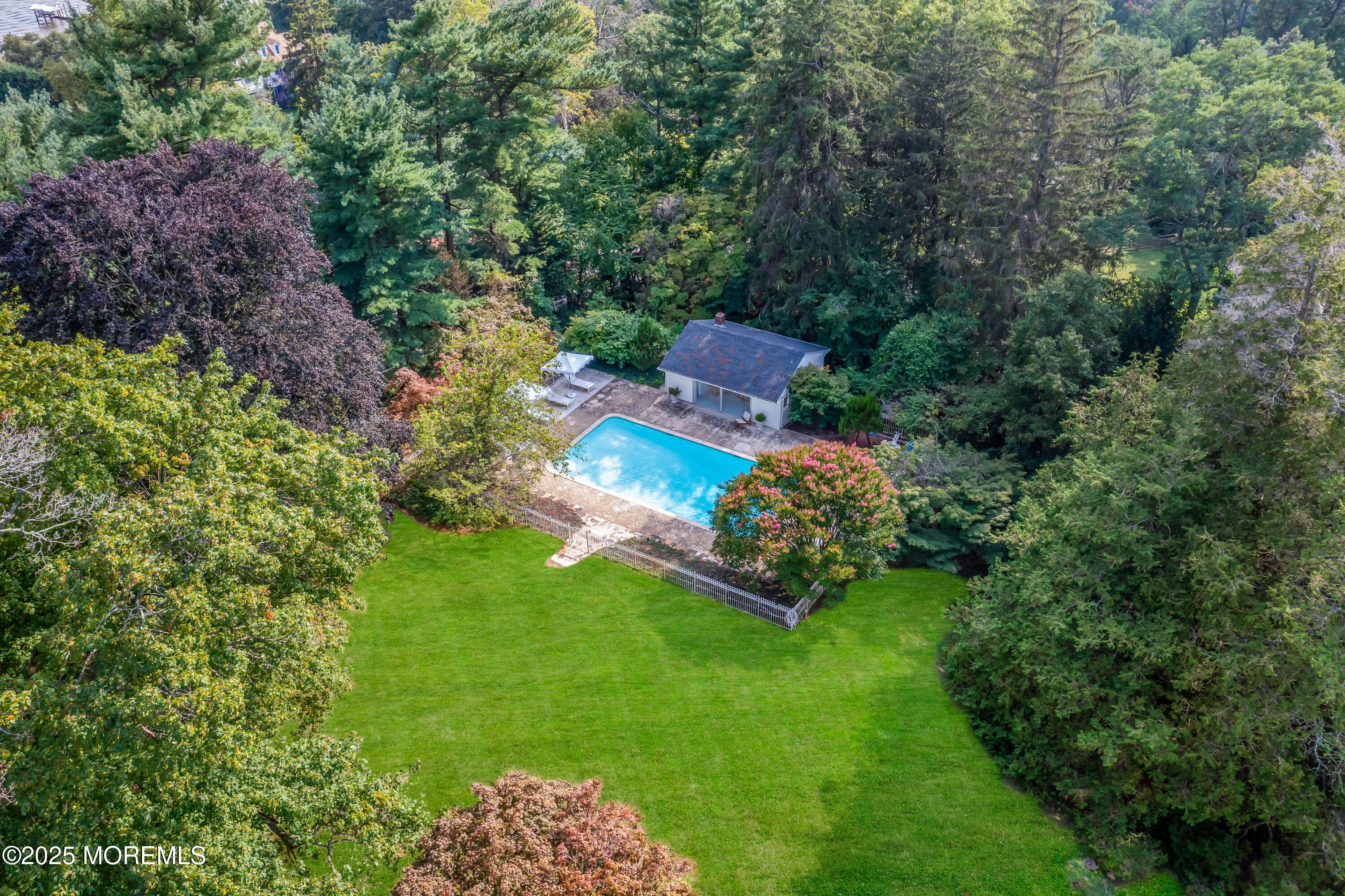 809 Navesink River Road Rumson, NJ 07760 - Photo 38 of 45 a view of a wooden house with a yard