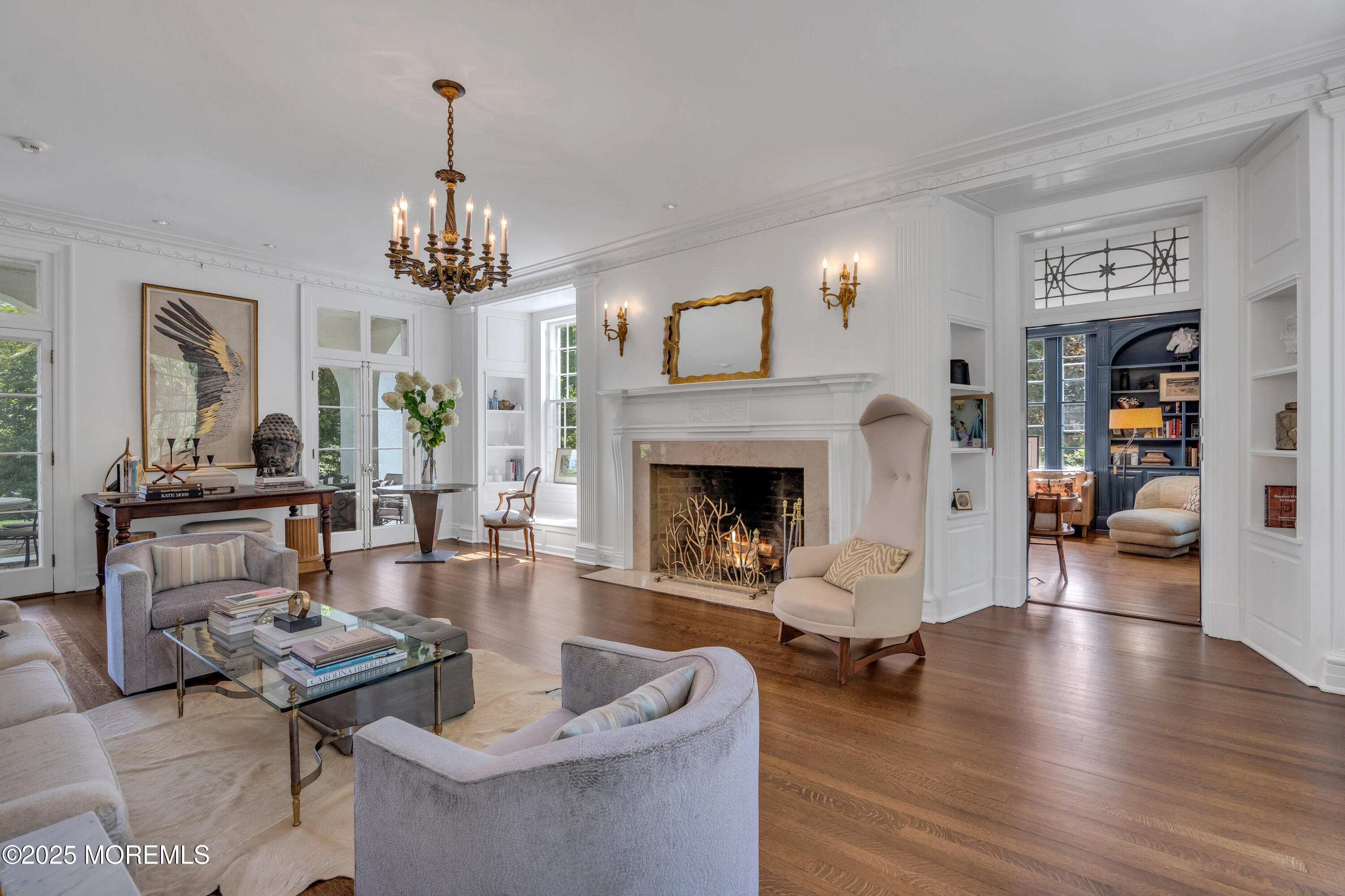 809 Navesink River Road Rumson, NJ 07760 - Photo 4 of 45 a living room with fireplace furniture and a chandelier