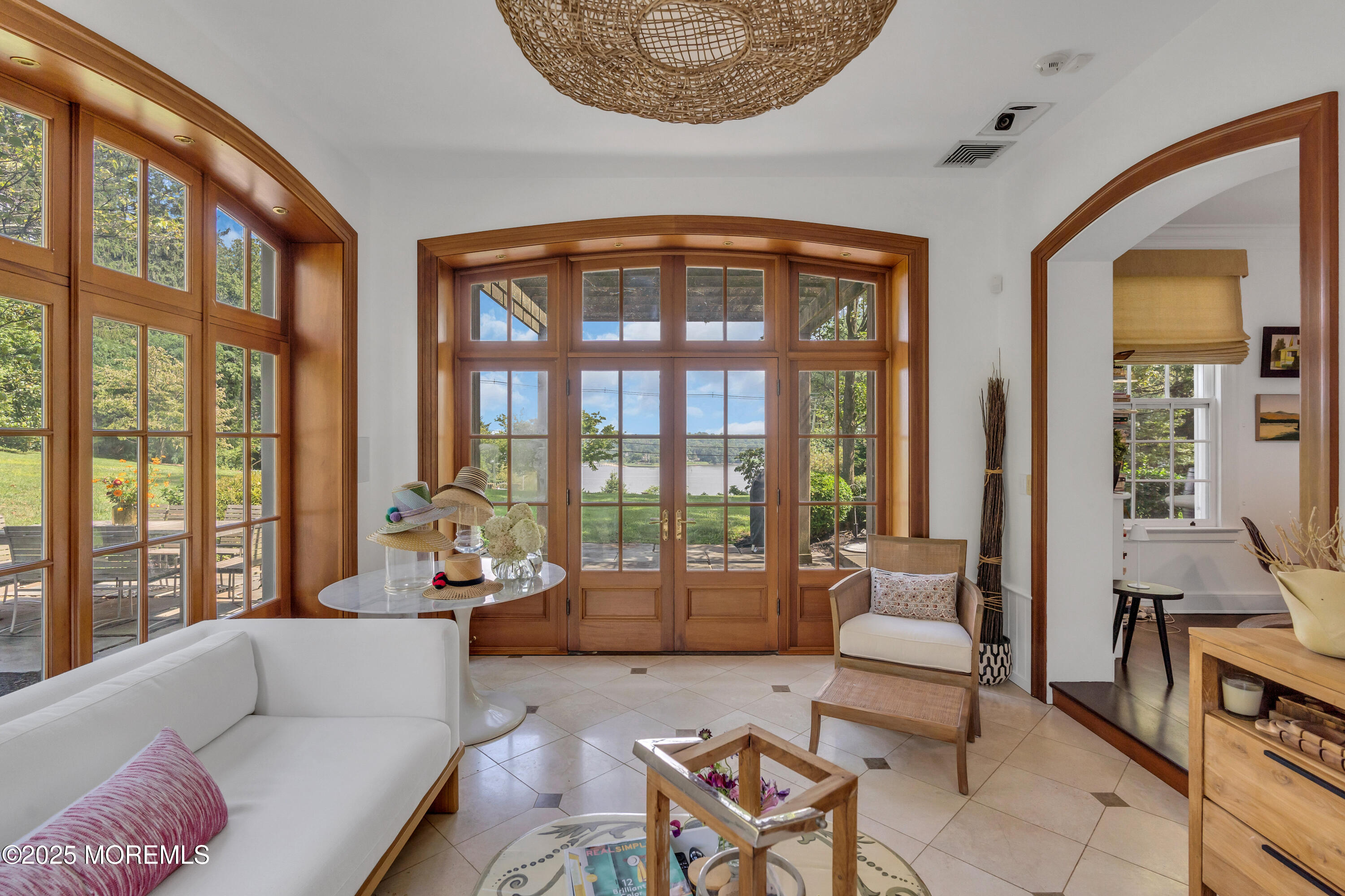 809 Navesink River Road Rumson, NJ 07760 - Photo 5 of 45 a living room with furniture and floor to ceiling windows
