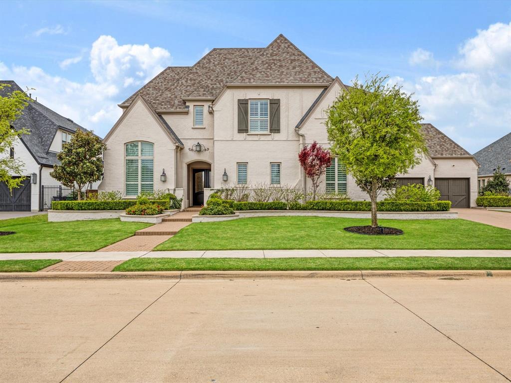621 Hawk Wood Lane Prosper, TX 75078 - Photo 2 of 40 a front view of a house with a yard