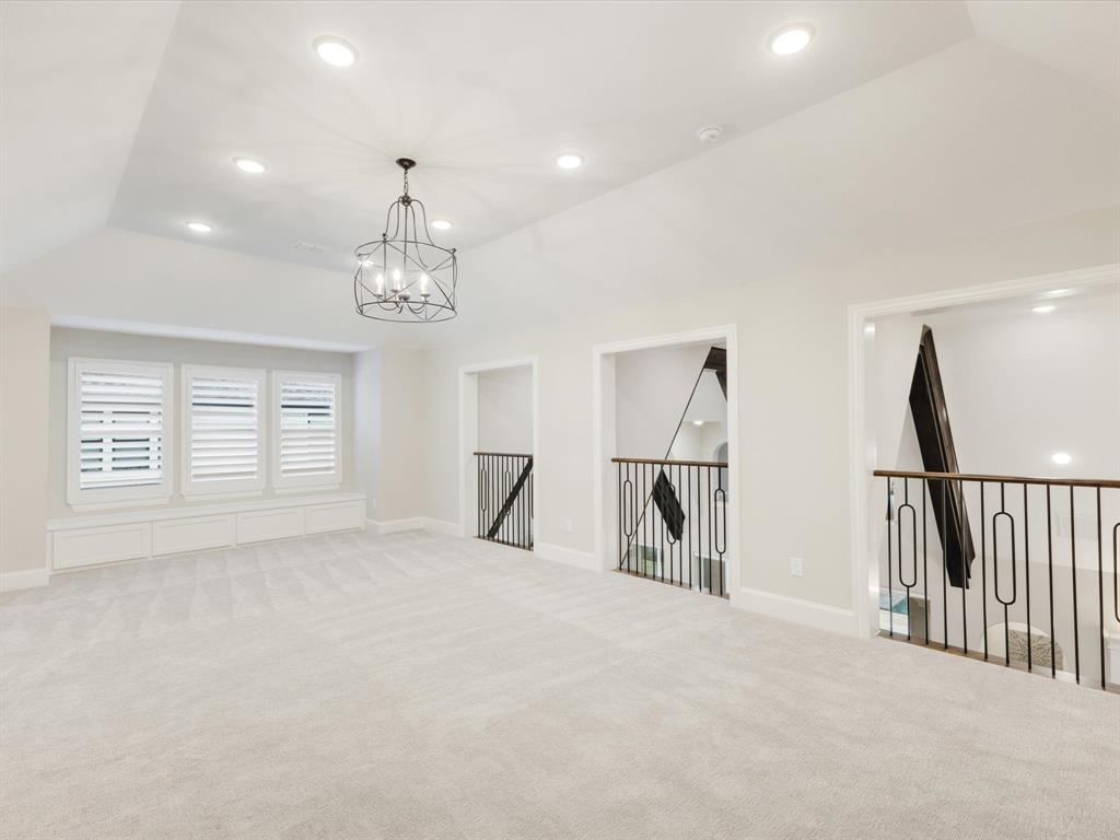 621 Hawk Wood Lane Prosper, TX 75078 - Photo 23 of 40 a view of empty room with stairs and windows