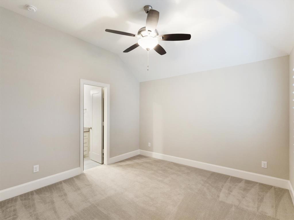 621 Hawk Wood Lane Prosper, TX 75078 - Photo 26 of 40 an empty room with a ceiling fan and window