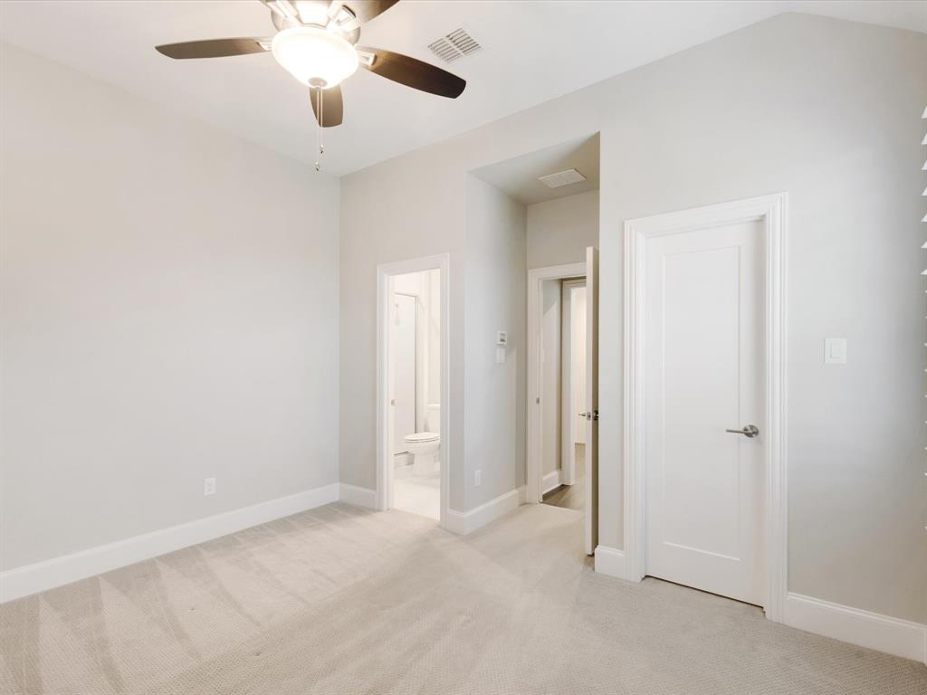 621 Hawk Wood Lane Prosper, TX 75078 - Photo 28 of 40 an empty room with closet and a chandelier fan