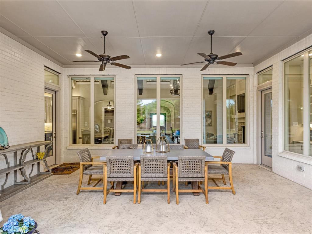 621 Hawk Wood Lane Prosper, TX 75078 - Photo 32 of 40 a view of a dining room with furniture window and wooden floor
