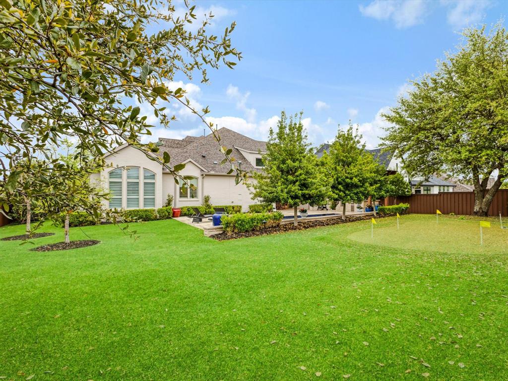 621 Hawk Wood Lane Prosper, TX 75078 - Photo 33 of 40 a view of house with garden space and trees