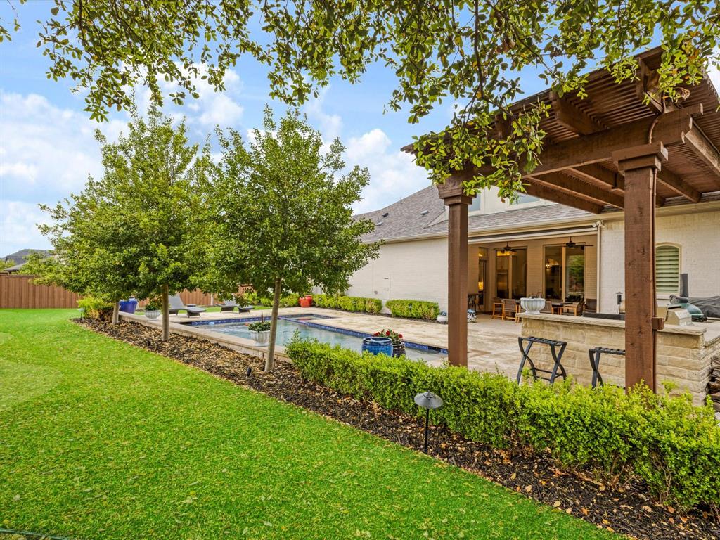 621 Hawk Wood Lane Prosper, TX 75078 - Photo 34 of 40 a view of a house with a yard porch and sitting area