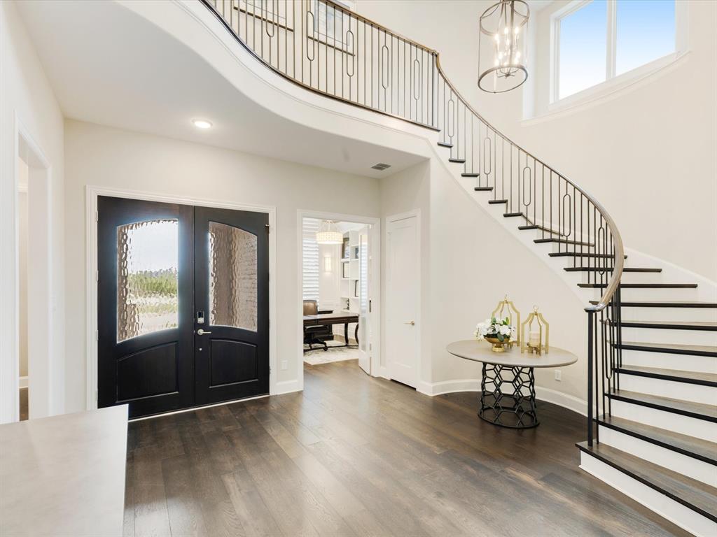 621 Hawk Wood Lane Prosper, TX 75078 - Photo 6 of 40 a view of entryway livingroom and hall with wooden floor