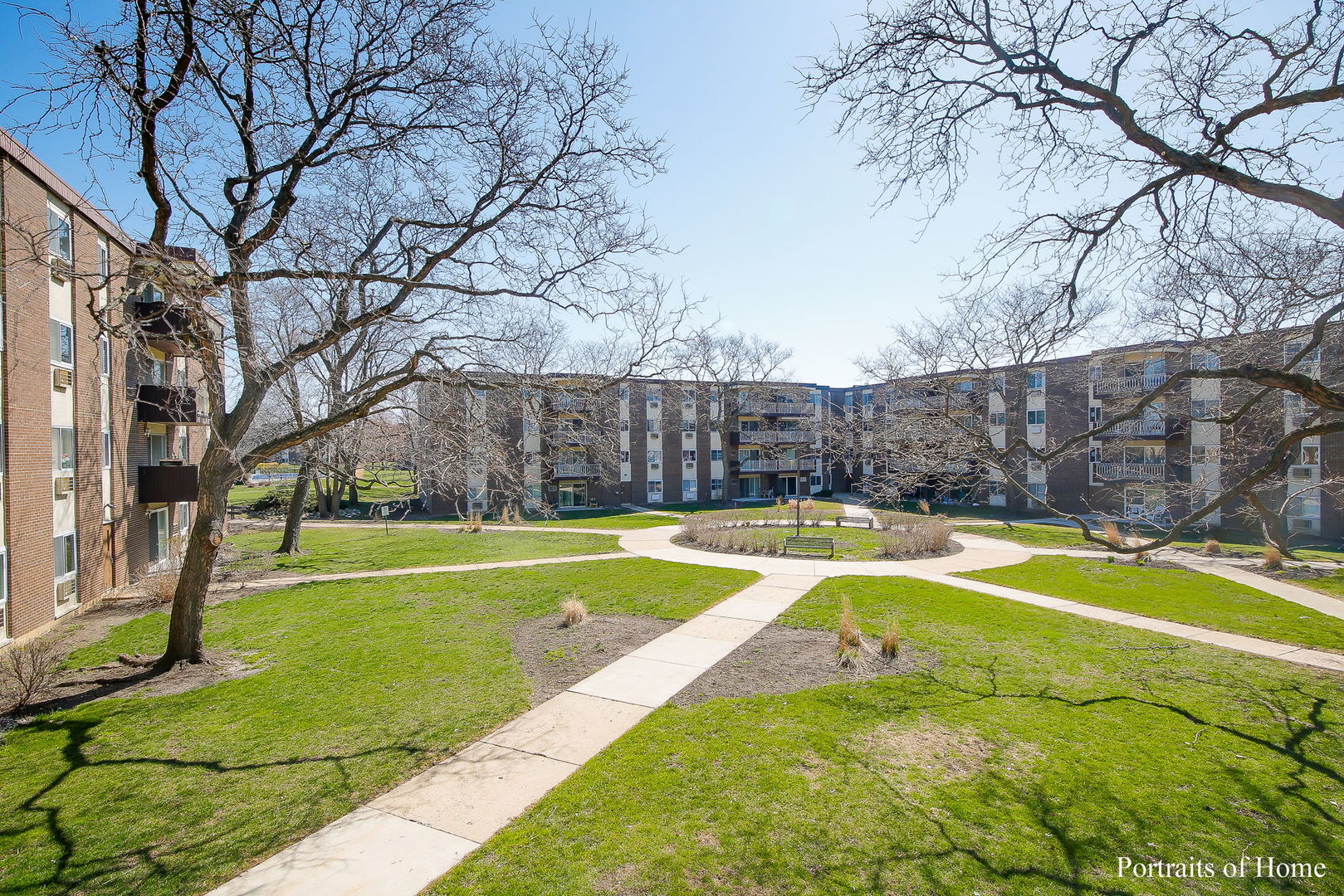 1301 South Finley Road, Unit 114 Lombard, IL 60148 - Photo 11 of 12 a view of a swimming pool with an outdoor space and seating area
