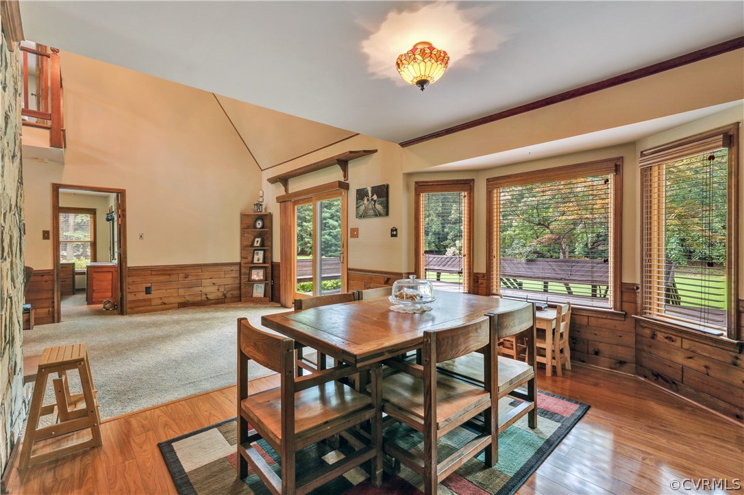 15100 Beach Road Chesterfield, VA 23838 - Photo 12 of 41 a view of a dining room and livingroom with furniture wooden floor and a rug