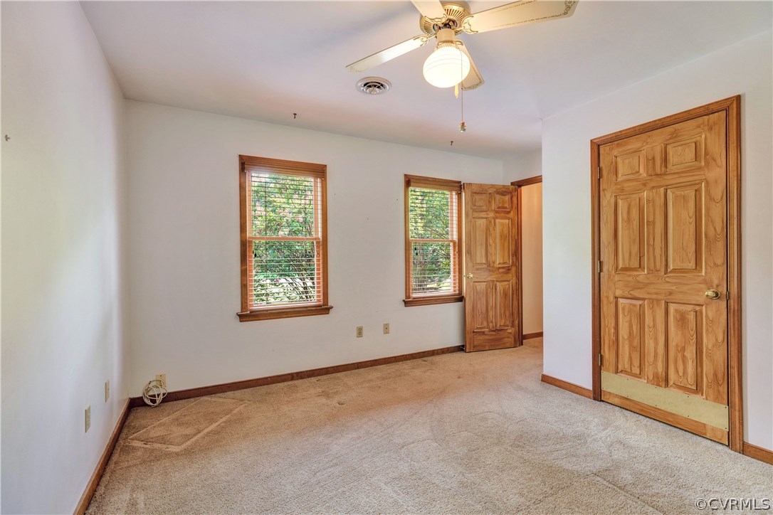 15100 Beach Road Chesterfield, VA 23838 - Photo 23 of 41 an empty room with windows and closet