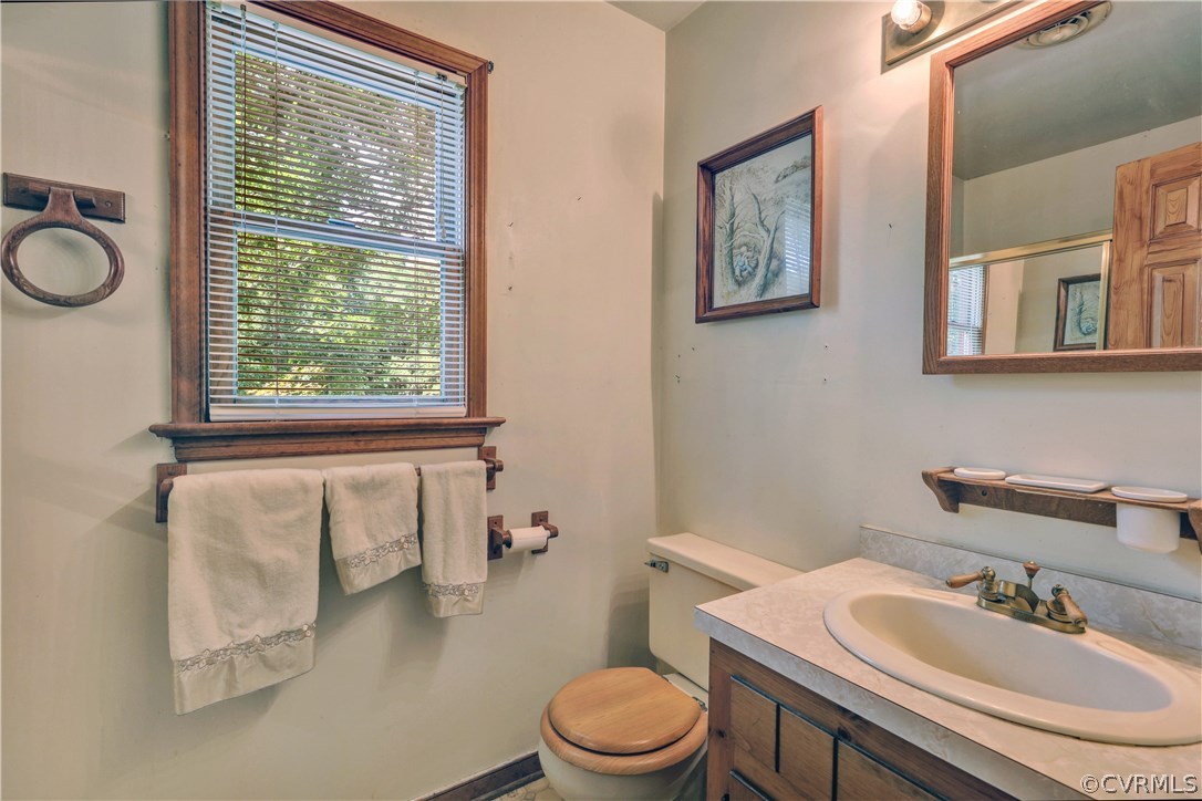 15100 Beach Road Chesterfield, VA 23838 - Photo 24 of 41 a bathroom with a sink vanity mirror and toilet