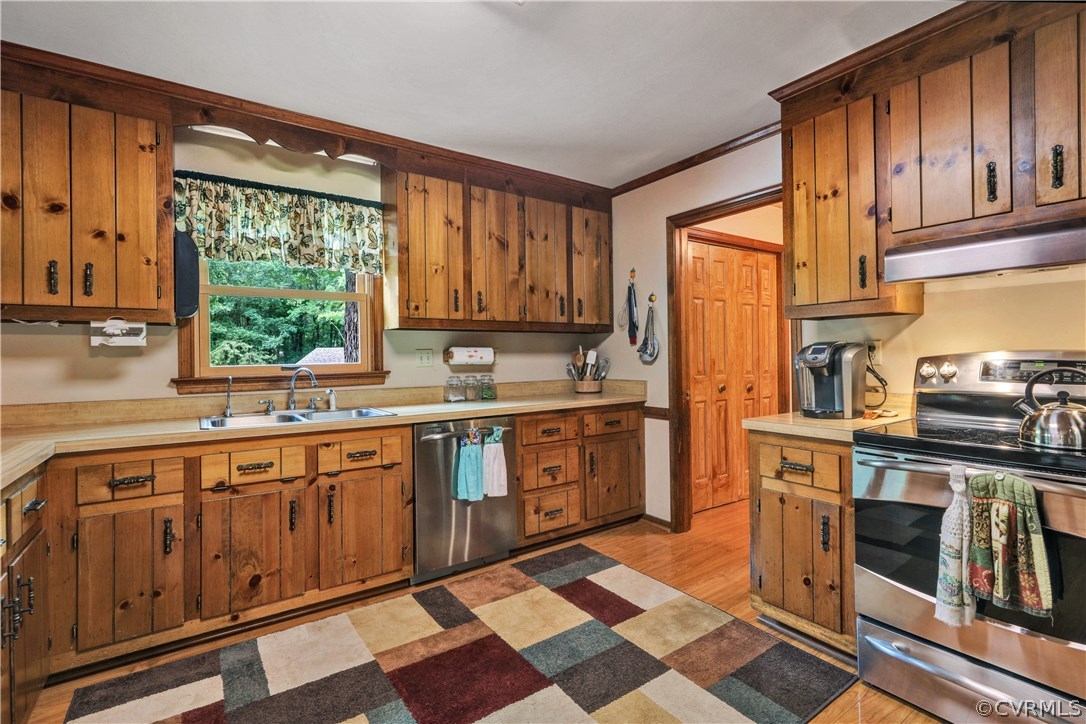 15100 Beach Road Chesterfield, VA 23838 - Photo 6 of 41 a kitchen with stainless steel appliances granite countertop a stove a sink and a refrigerator