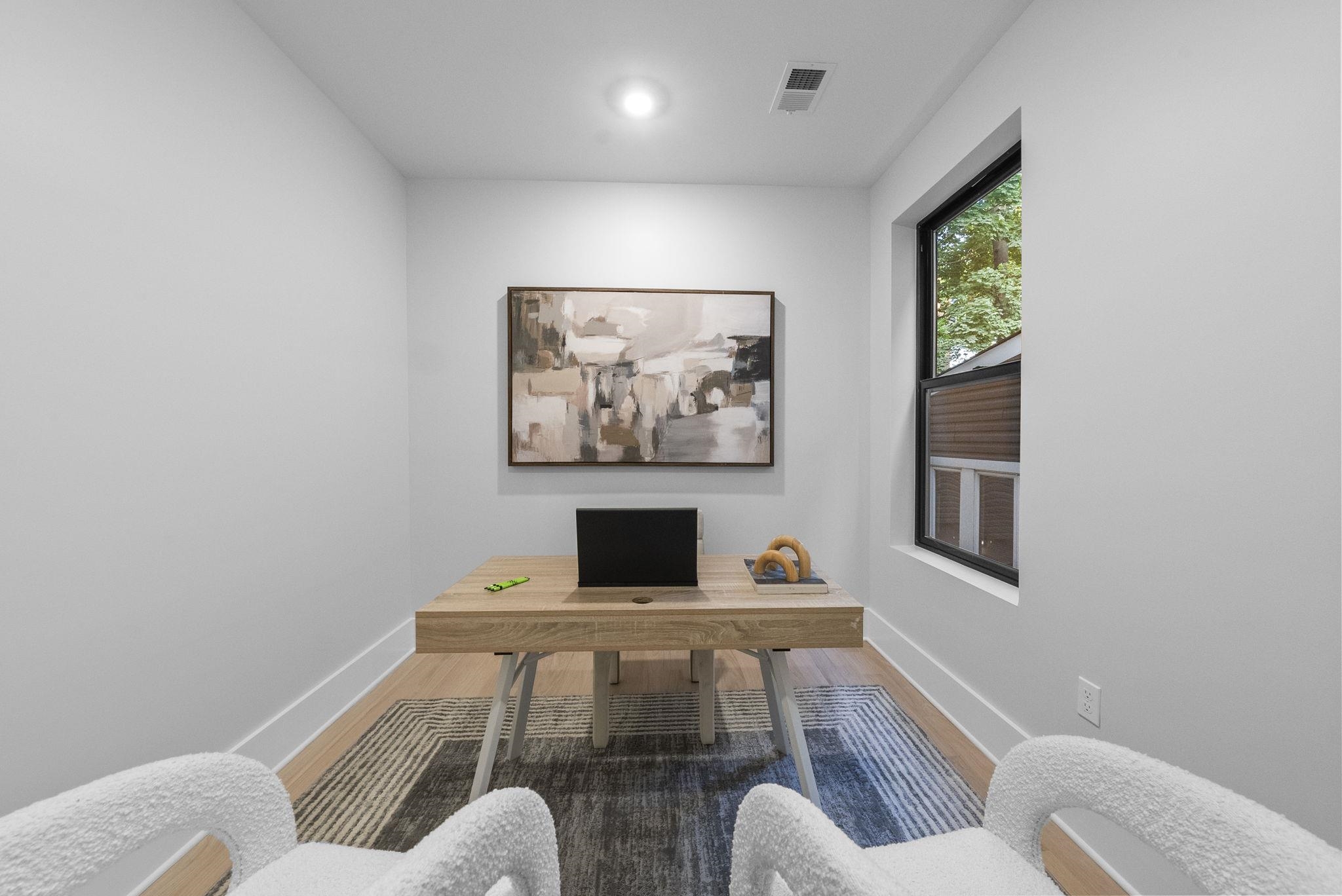 124 Glenwood Avenue Jersey City, NJ 07306 - Photo 16 of 42 a living room with furniture and a flat screen tv