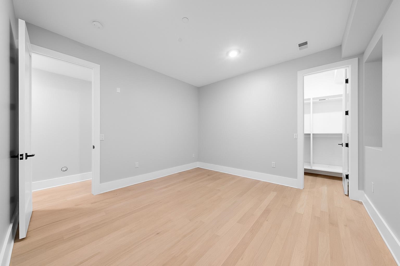 124 Glenwood Avenue Jersey City, NJ 07306 - Photo 24 of 42 wooden floor in an empty room with a window