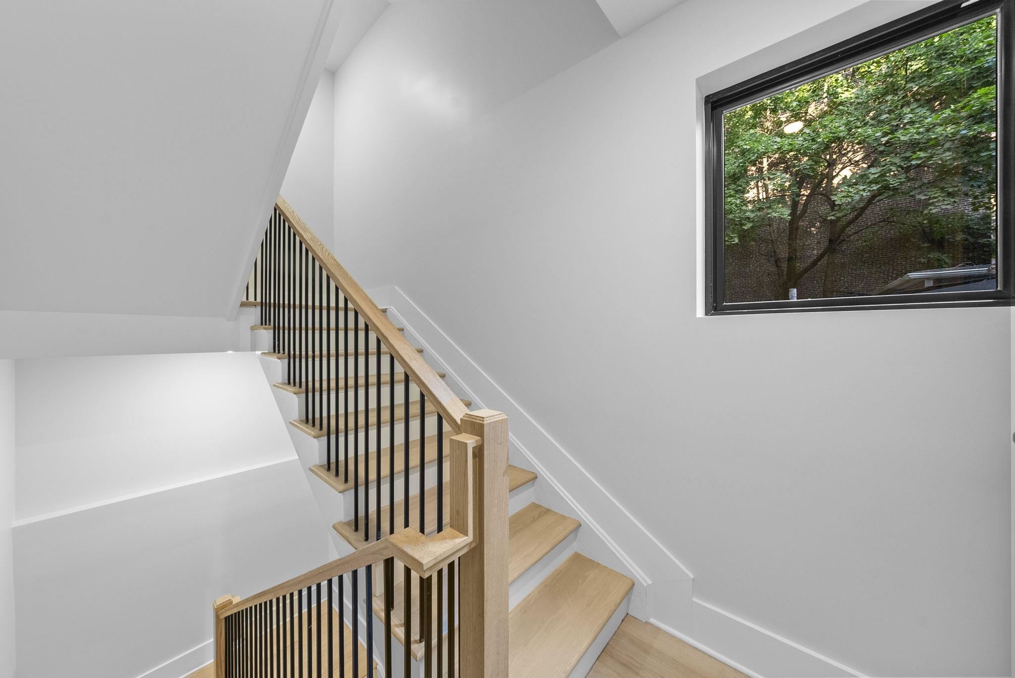 124 Glenwood Avenue Jersey City, NJ 07306 - Photo 31 of 42 a view of entryway and hall with wooden floor