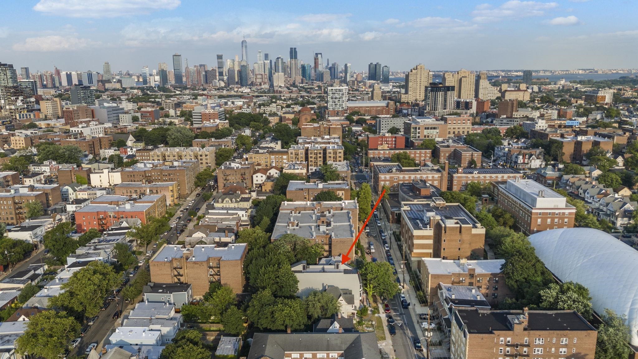 124 Glenwood Avenue Jersey City, NJ 07306 - Photo 41 of 42 a view of a city with tall buildings