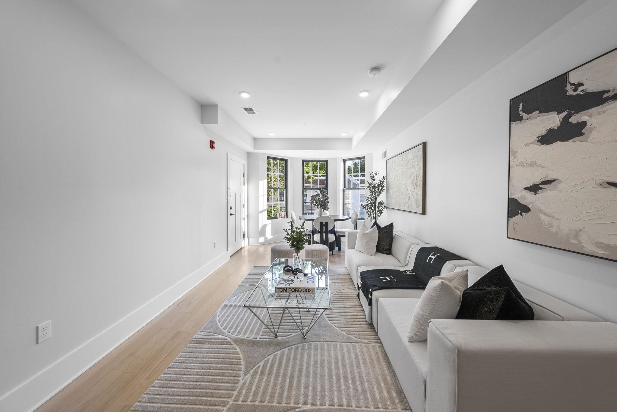 124 Glenwood Avenue Jersey City, NJ 07306 - Photo 5 of 42 a living room with furniture and a window