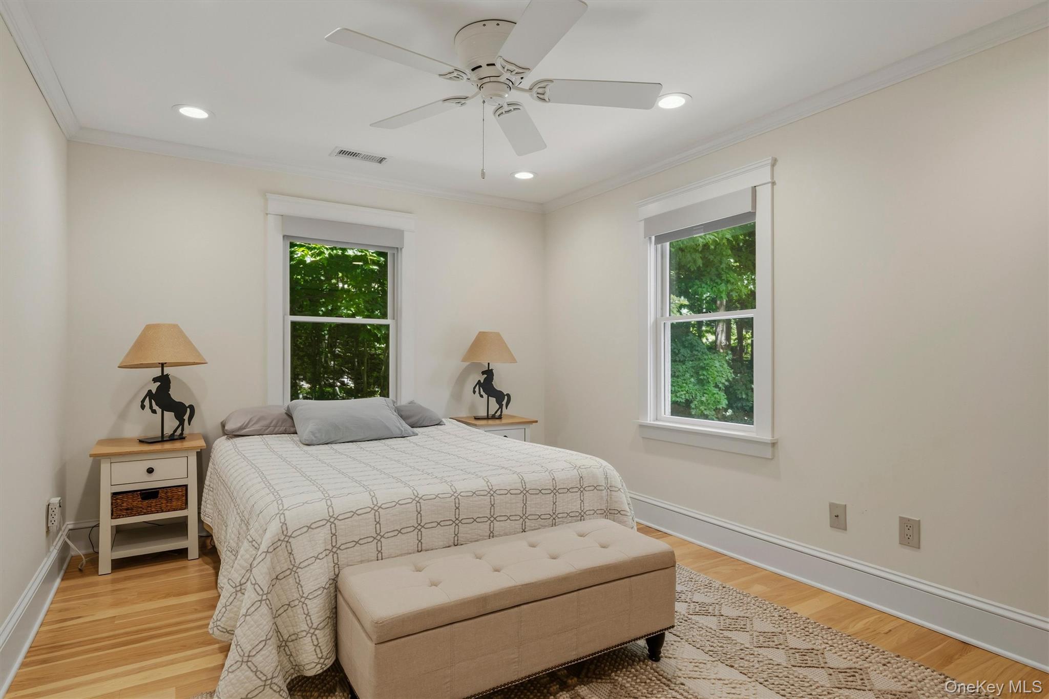324 Haverstraw Road Suffern, NY 10901 - Photo 24 of 50 a bedroom with a bed and a chandelier