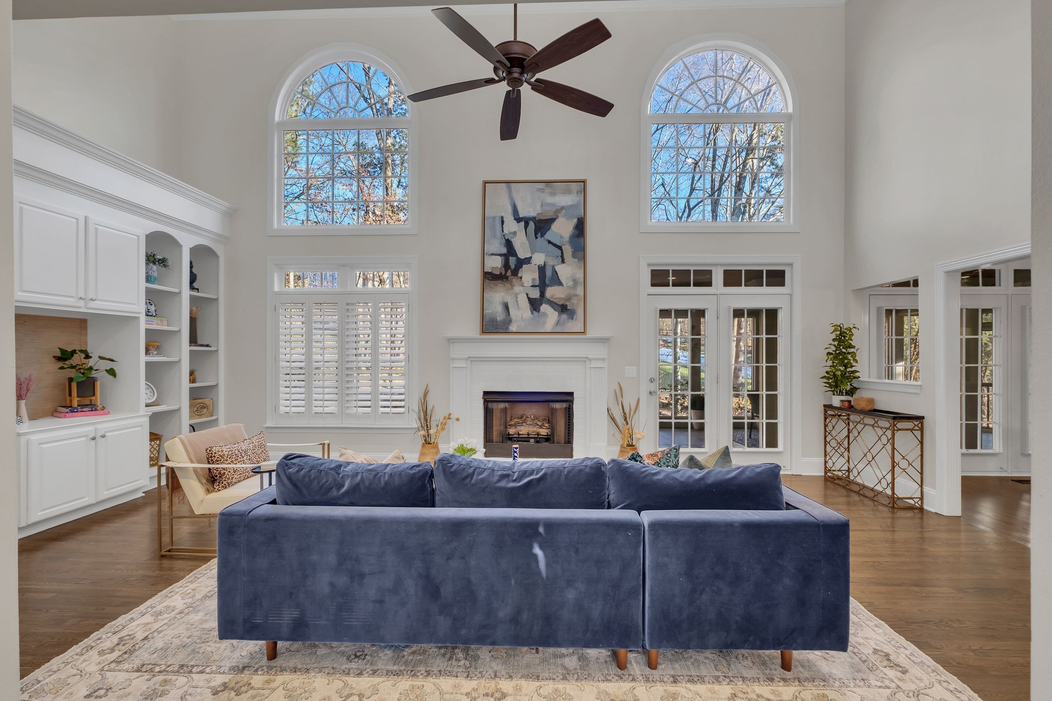 306 Rothwell Place Franklin, TN 37069 - Photo 17 of 91 a living room with furniture a chandelier and a fireplace