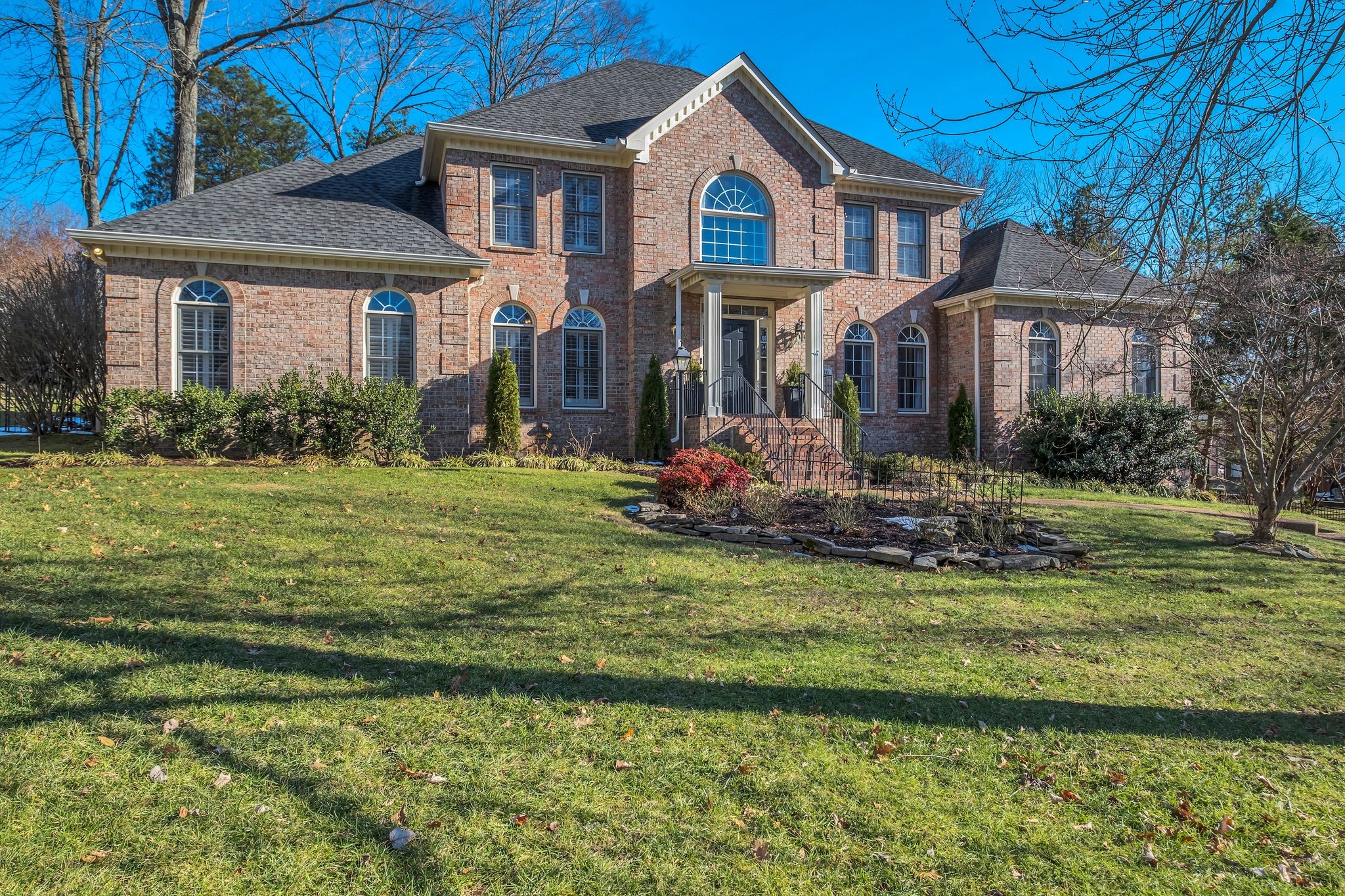 306 Rothwell Place Franklin, TN 37069 - Photo 2 of 91 a front view of a house with a yard