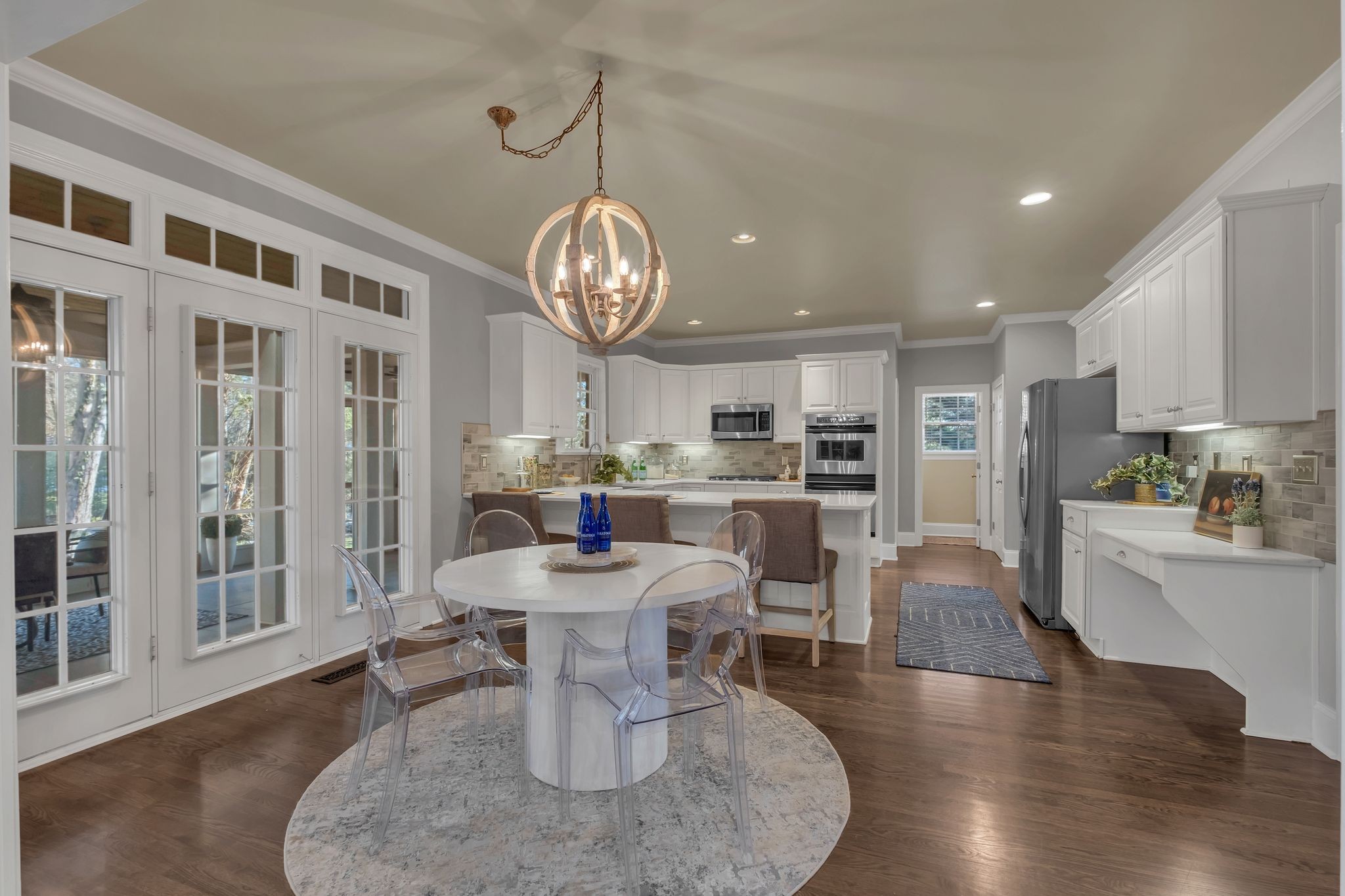 306 Rothwell Place Franklin, TN 37069 - Photo 21 of 91 a view of a dining room with furniture wooden floor and chandelier