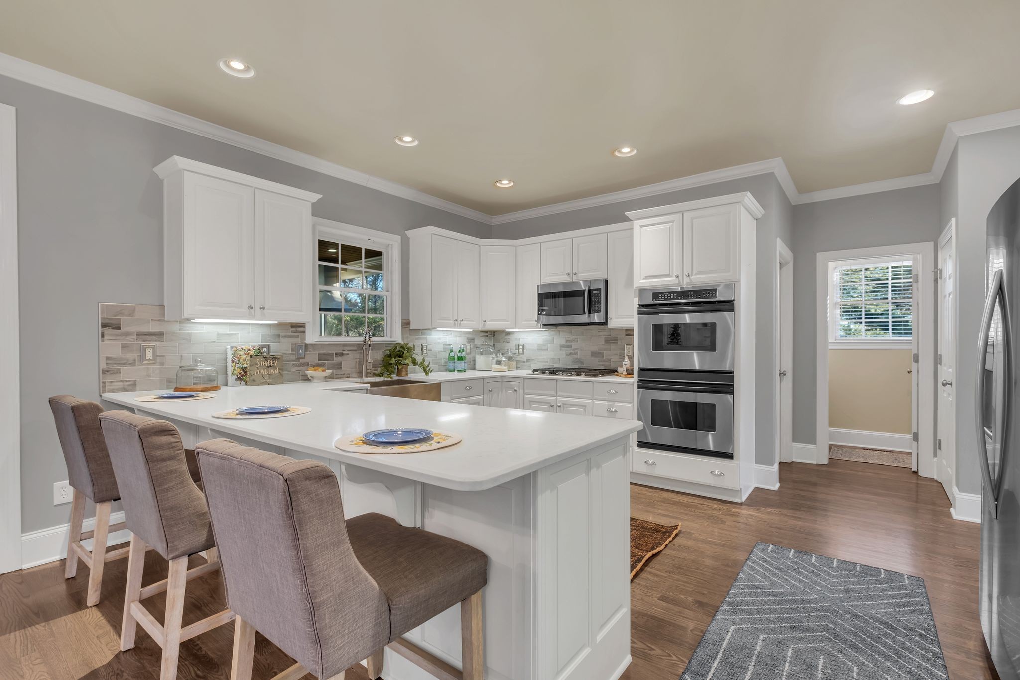 306 Rothwell Place Franklin, TN 37069 - Photo 24 of 91 a kitchen with stainless steel appliances kitchen island granite countertop a sink and cabinets