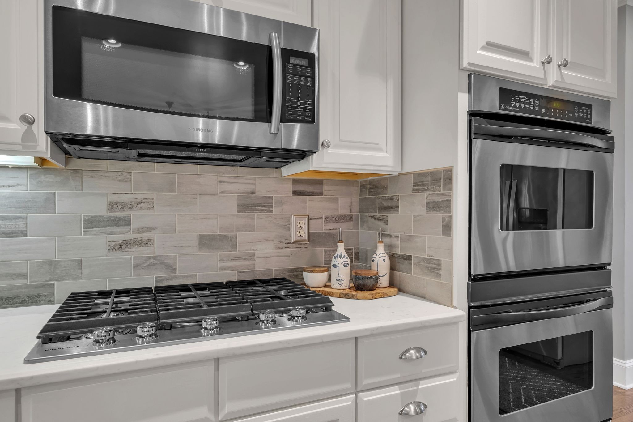 306 Rothwell Place Franklin, TN 37069 - Photo 26 of 91 a kitchen with granite countertop a stove and a microwave