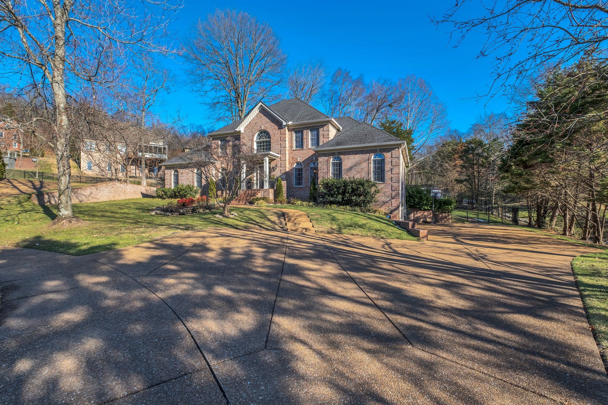 306 Rothwell Place Franklin, TN 37069 - Photo 3 of 91 a front view of a house with a yard