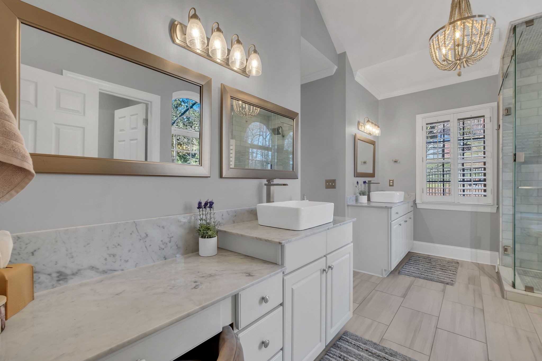 306 Rothwell Place Franklin, TN 37069 - Photo 34 of 91 a bathroom with a sink a large mirror and a bathtub