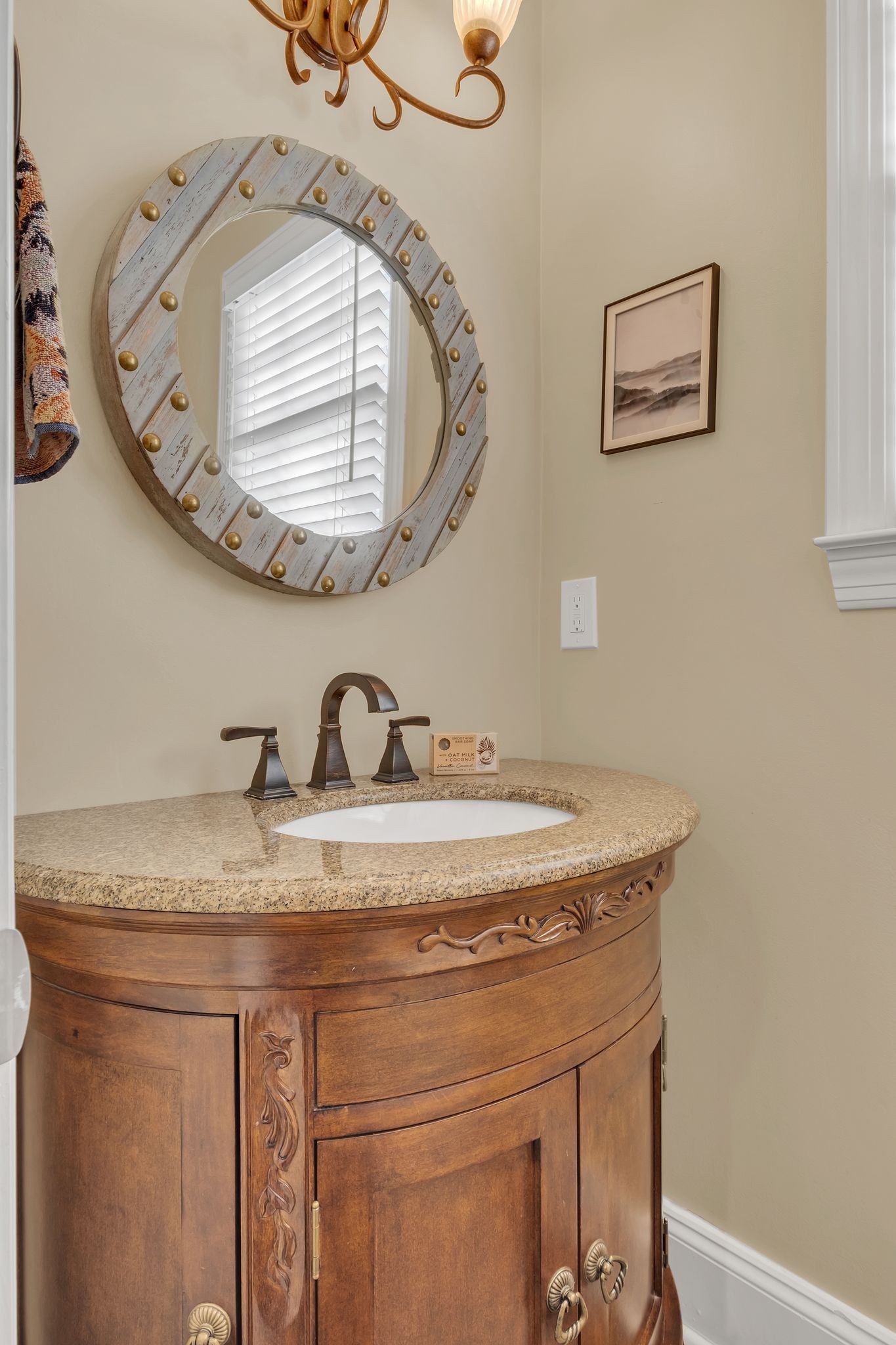 306 Rothwell Place Franklin, TN 37069 - Photo 38 of 91 a bathroom with a granite countertop sink a mirror and a vanity