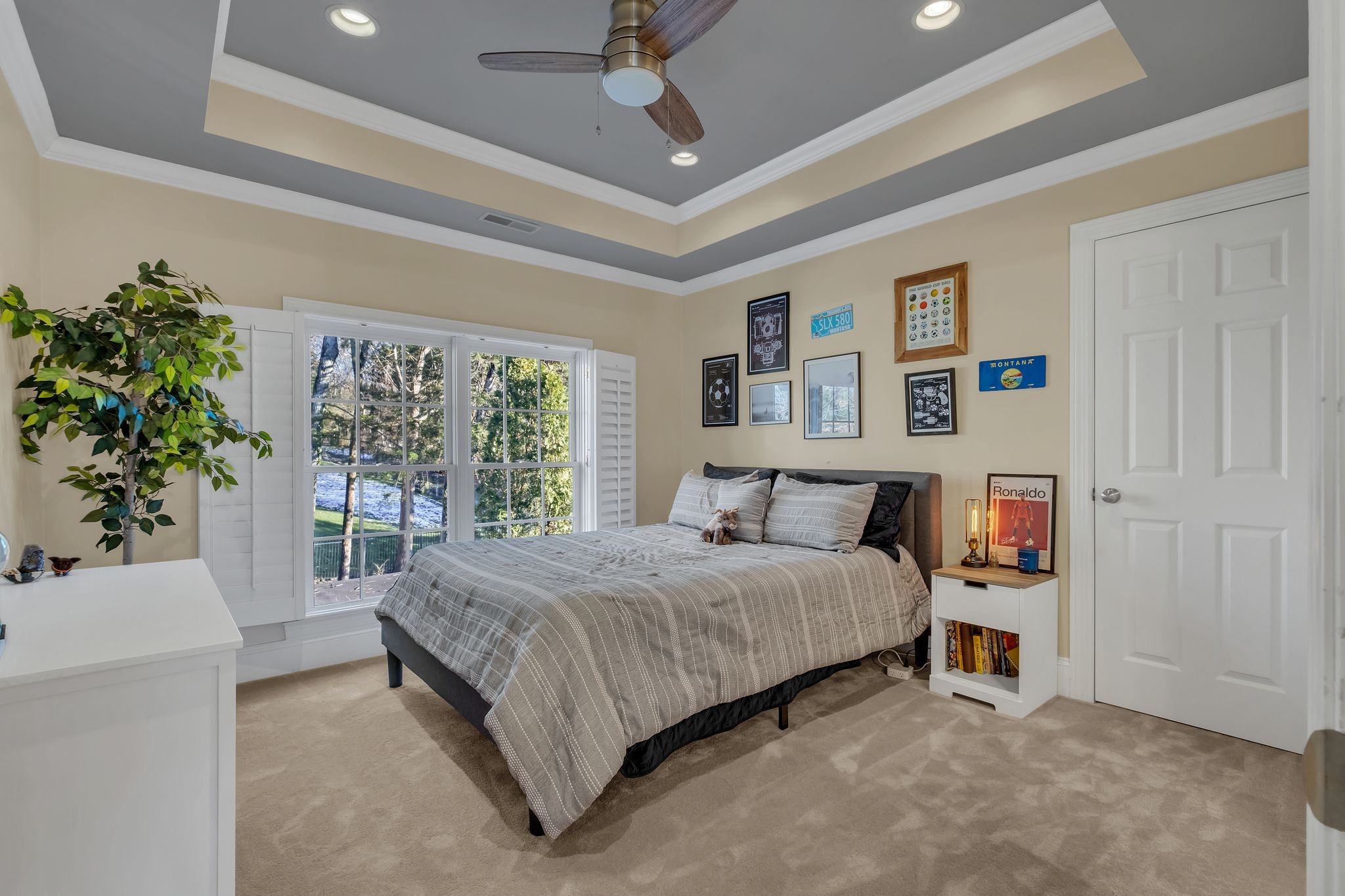 306 Rothwell Place Franklin, TN 37069 - Photo 56 of 91 a bedroom with a large bed and a chandelier