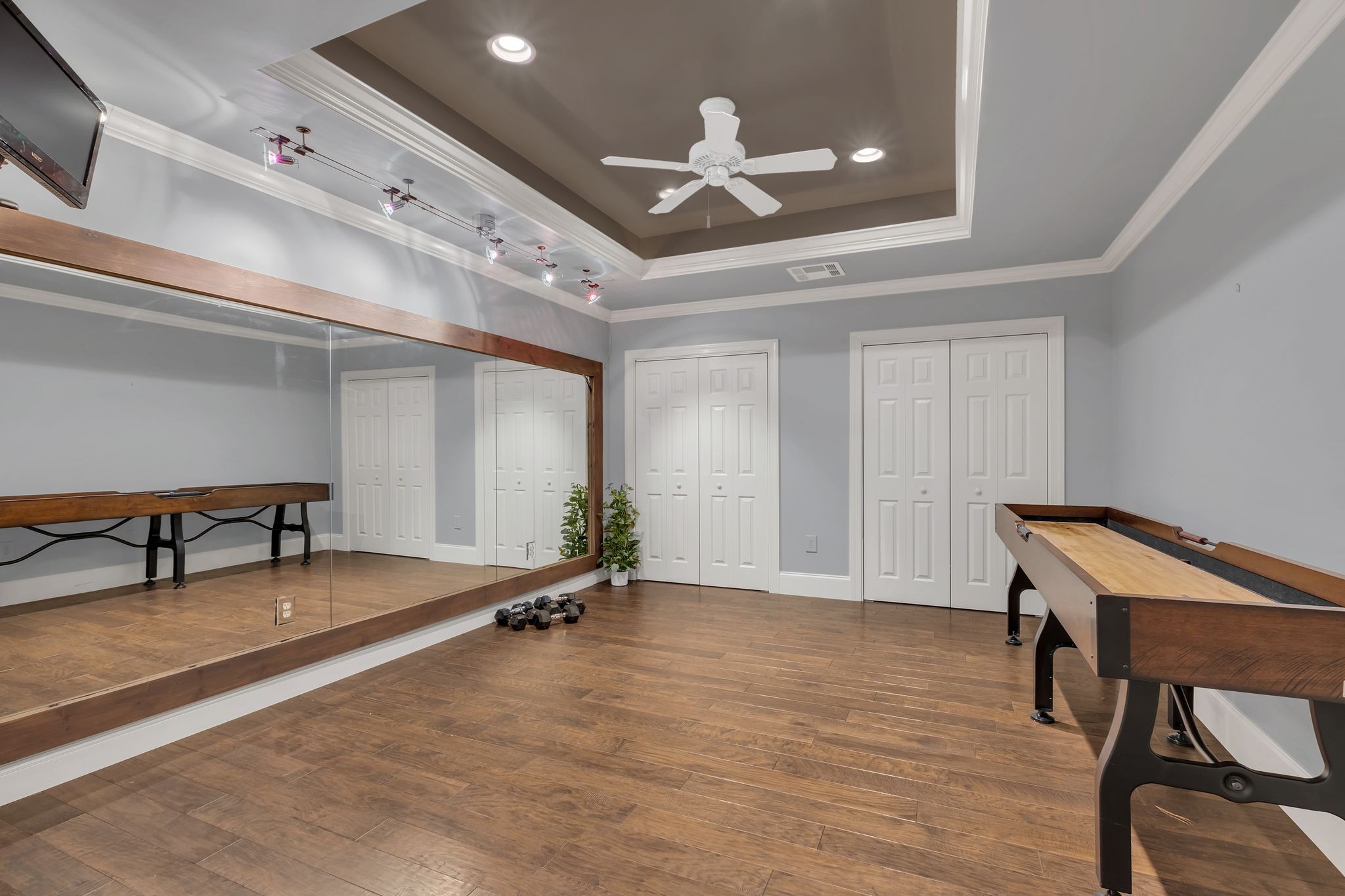 306 Rothwell Place Franklin, TN 37069 - Photo 63 of 91 a view of a room with gym equipment and a large window