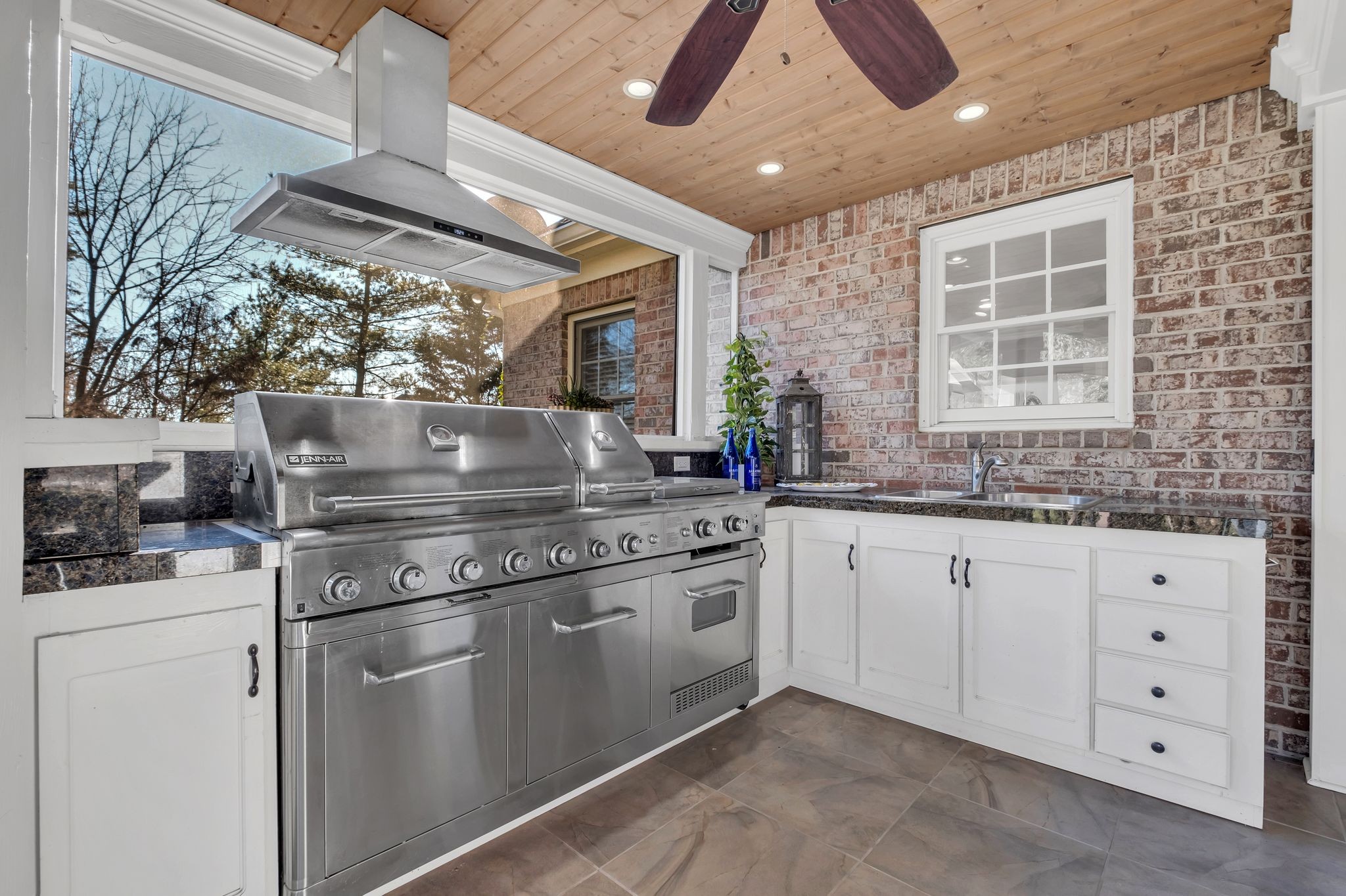 306 Rothwell Place Franklin, TN 37069 - Photo 70 of 91 a kitchen with granite countertop a sink stainless steel appliances and cabinets
