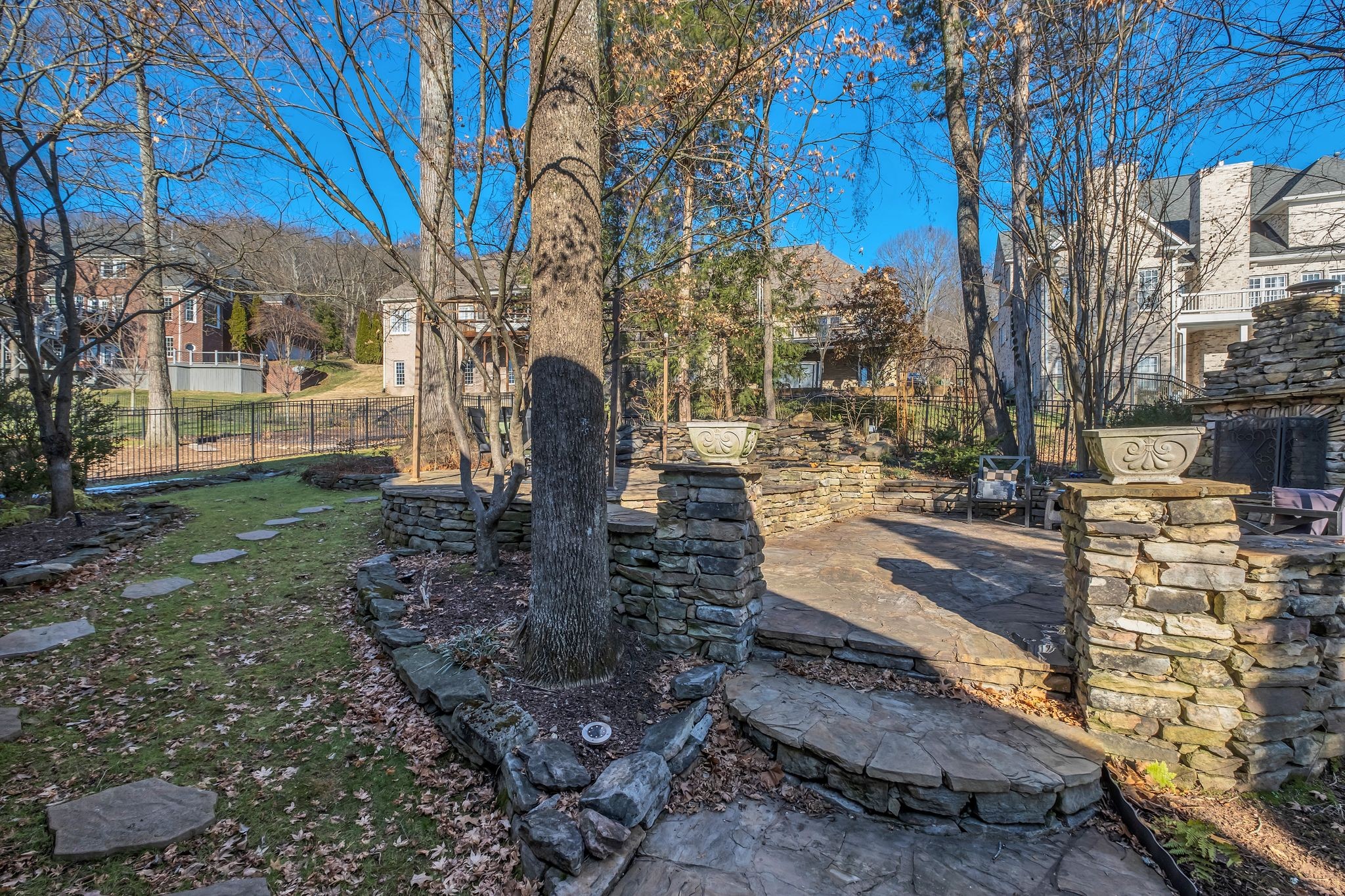 306 Rothwell Place Franklin, TN 37069 - Photo 77 of 91 Exterior back-yard stone patio with wood-burning fireplace, fish pond, and gazebo