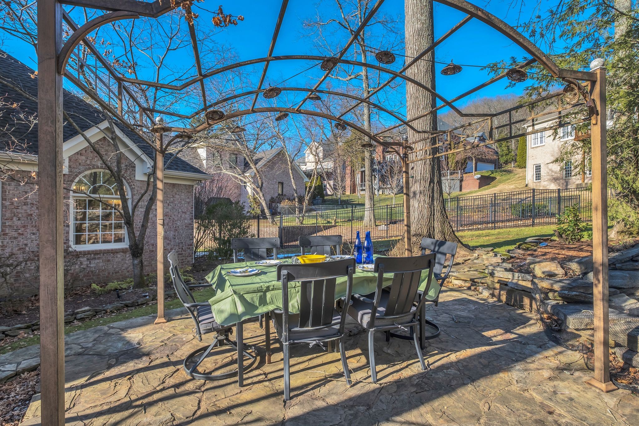306 Rothwell Place Franklin, TN 37069 - Photo 84 of 91 a view of a patio with table and chairs under an umbrella