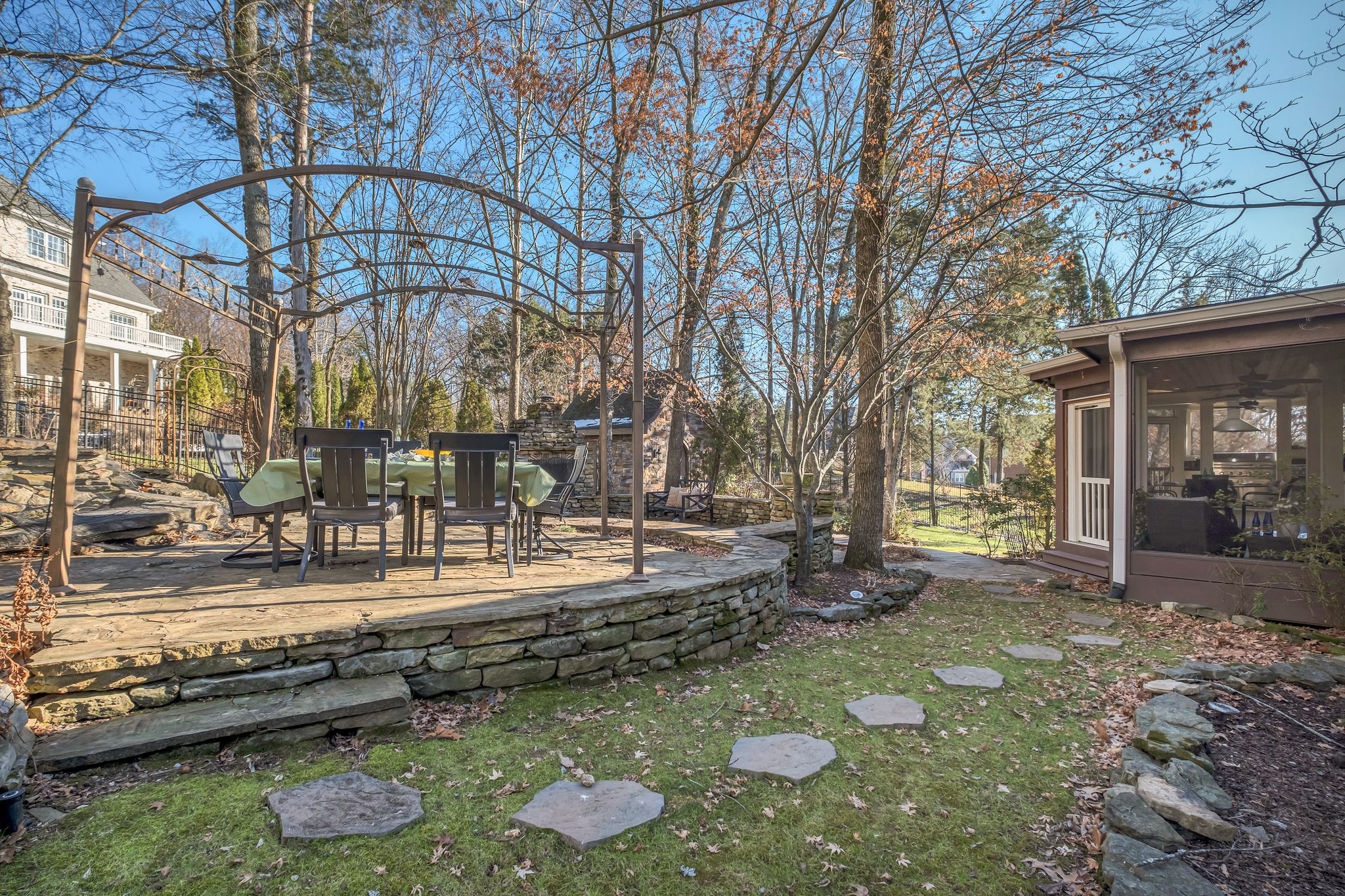 306 Rothwell Place Franklin, TN 37069 - Photo 87 of 91 a backyard of a house with barbeque oven and trees