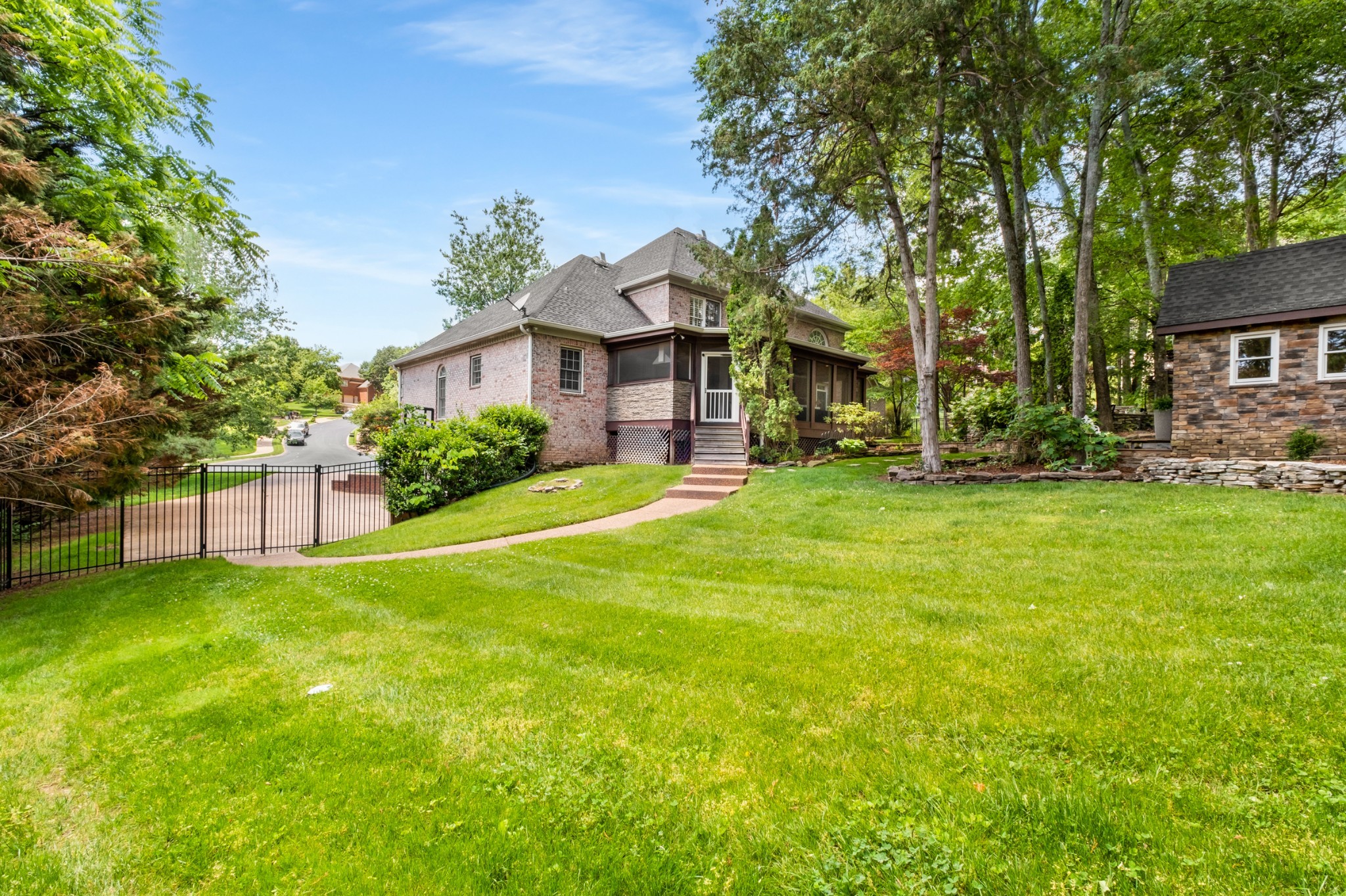 306 Rothwell Place Franklin, TN 37069 - Photo 89 of 91 a view of a house with a big yard and large trees