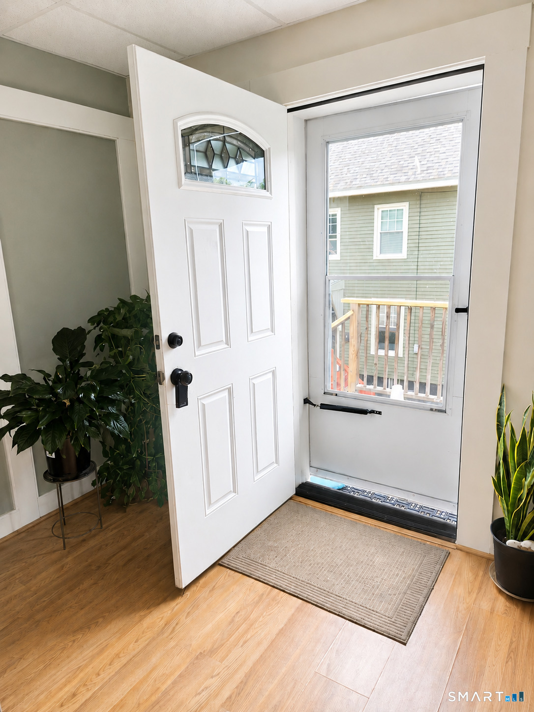 61 Bartlett Street Meriden, CT 06451 - Photo 22 of 30 an entryway with wooden floor and front door