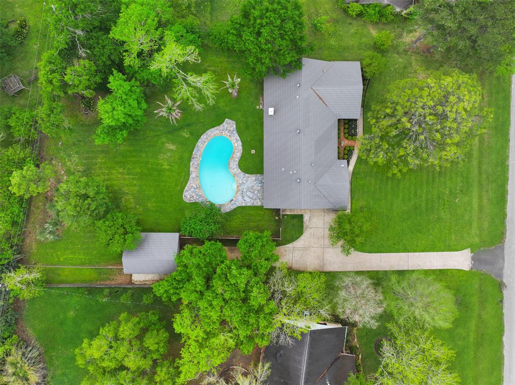 2006 Deepbrook Drive Pearland, TX 77581 - Photo 1 of 40 Notice the lifetime roof, the sparkling pool, and the massive wooded LOT in this drone shot! The house also features a full home generator, 2021 Trane AC unit and duct work, and a new electrical panel.