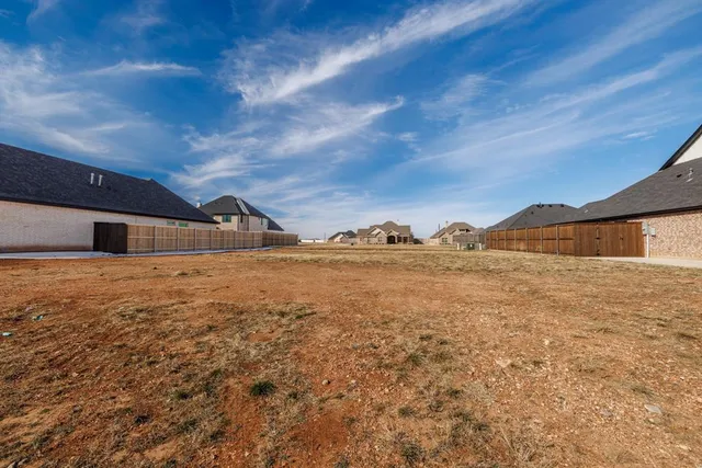 a view of large house with a yard