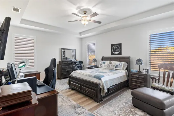 a bedroom with a bed and a couch