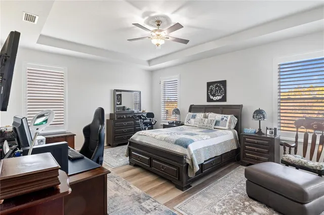 a bedroom with a bed and a couch