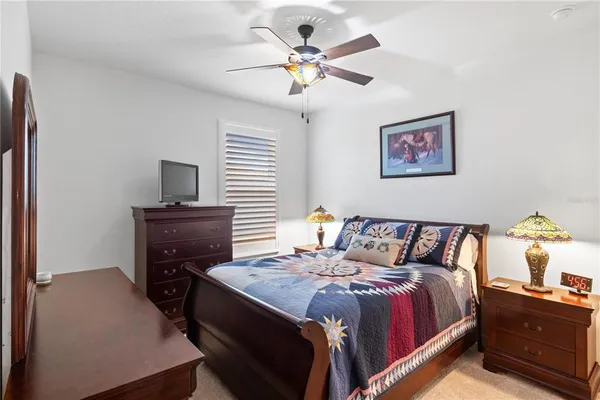 a bed room with a bed and a chandelier