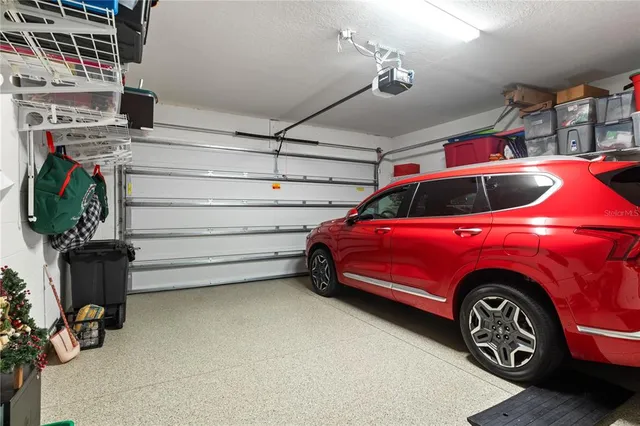 a view of a garage and a car parked in it