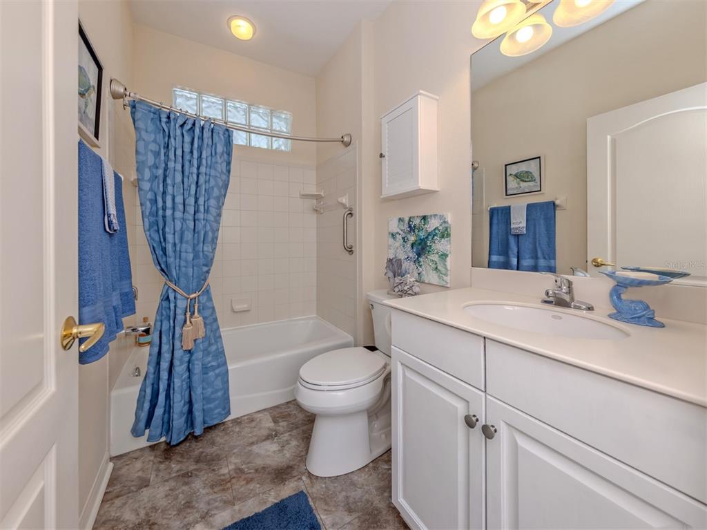 205 Reclinata Circle Venice, FL 34292 - Photo 30 of 62 a bathroom with a sink a toilet and shower