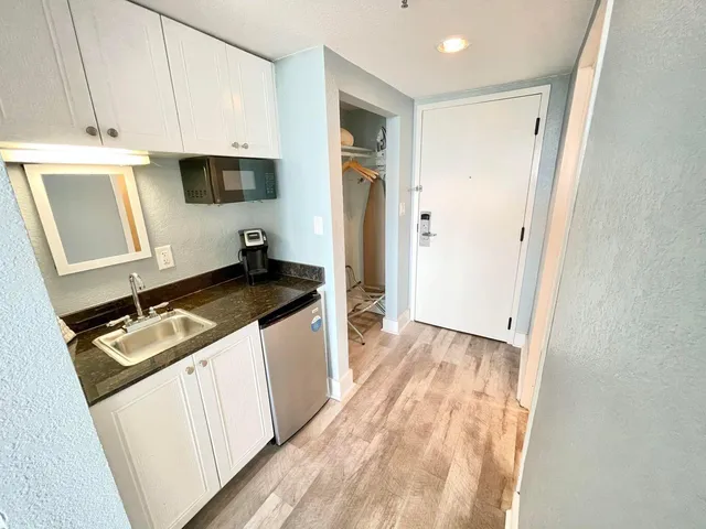 a view of balcony with furniture