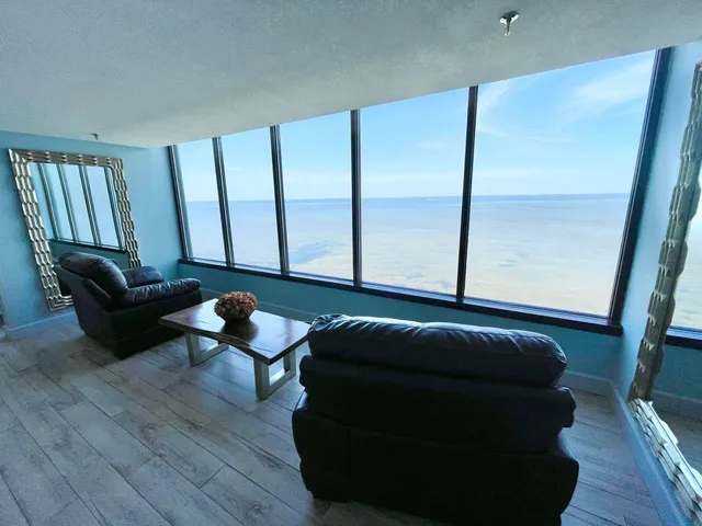 an outdoor space with plants and umbrella