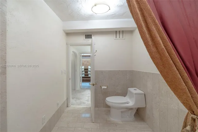 a bathroom with a bathtub and shower