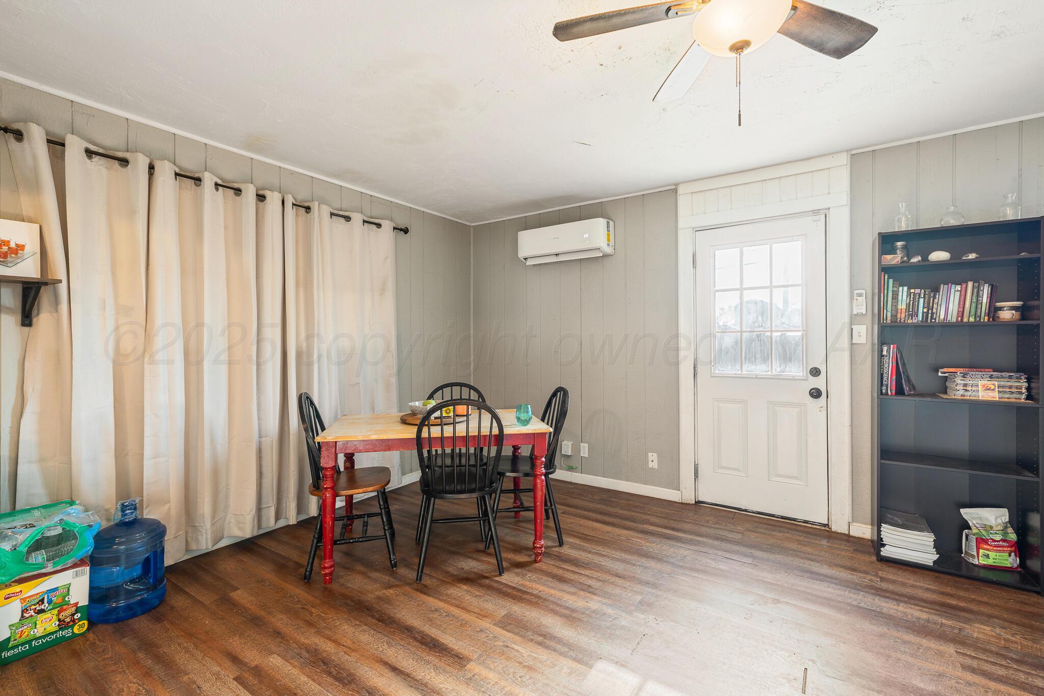 4607 Parker Street Amarillo, TX 79110 - Photo 6 of 11 a view of a room with furniture and wooden floor